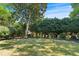 Lush backyard with black mulch beds and beautiful landscaping, creating a serene outdoor space at 605 Tatum Ct, Alpharetta, GA 30022