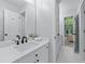 Modern bathroom featuring sleek vanity, mirror, and tile flooring at 605 Tatum Ct, Alpharetta, GA 30022