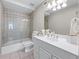 Clean bathroom with tiled shower, white vanity, and modern fixtures at 605 Tatum Ct, Alpharetta, GA 30022