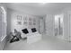 Neutral bedroom with seating, natural light, and minimalist wall art at 605 Tatum Ct, Alpharetta, GA 30022