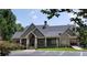 Beautiful clubhouse featuring a covered porch, stone and brick facade at 605 Tatum Ct, Alpharetta, GA 30022