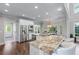 Kitchen with stainless steel appliances, granite countertops, and breakfast bar seating at 605 Tatum Ct, Alpharetta, GA 30022
