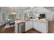 Bright kitchen with stainless appliances, granite countertops, and open floor plan at 605 Tatum Ct, Alpharetta, GA 30022