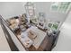 Bright living room with fireplace, hardwood floors, large windows, and elegant chandelier at 605 Tatum Ct, Alpharetta, GA 30022