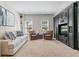 Finished basement with a lounge area featuring plush seating and built in entertainment center at 605 Tatum Ct, Alpharetta, GA 30022