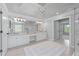 Luxurious main bathroom featuring double vanity, tile flooring, vanity lighting, and shower at 605 Tatum Ct, Alpharetta, GA 30022