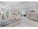 Bright and airy main bedroom featuring seating area, natural light, neutral decor, and carpet flooring at 605 Tatum Ct, Alpharetta, GA 30022
