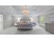 Elegant main bedroom with tray ceilings, chandelier, carpet flooring, and ensuite bathroom at 605 Tatum Ct, Alpharetta, GA 30022
