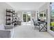 Bright home office features large windows, built-in bookshelves, and a comfortable seating area at 605 Tatum Ct, Alpharetta, GA 30022