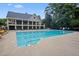 A large community pool with ample seating and a covered lounge area at 605 Tatum Ct, Alpharetta, GA 30022