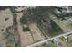 Aerial view of property, featuring the home, yard, and surrounding greenery at 1277 Bethany Rd, Covington, GA 30016