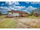 Backyard featuring a brick and vinyl house with a porch, a playhouse, and stairs with plenty of potential at 1277 Bethany Rd, Covington, GA 30016