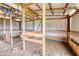 Image of a barn interior decorated with ribbons, showing wooden stalls at 1277 Bethany Rd, Covington, GA 30016
