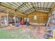 Inside the barn showing equipment with a motorcycle, a mechanic's tool chest, and ample natural light at 1277 Bethany Rd, Covington, GA 30016