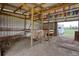 Spacious barn interior showing stall construction, ribbons, and lighting at 1277 Bethany Rd, Covington, GA 30016