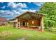 Partially constructed barn featuring an open frame and wooden siding at 1277 Bethany Rd, Covington, GA 30016