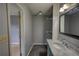 The bathroom features tile floors, a large mirror, and a marble countertop at 1277 Bethany Rd, Covington, GA 30016