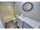 Clean bathroom features a marble vanity, framed mirror, and a combined shower/tub at 1277 Bethany Rd, Covington, GA 30016