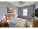 A bedroom featuring a queen bed with wood frame, two side tables with lamps, and one window at 1277 Bethany Rd, Covington, GA 30016