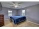 Bedroom with a full-sized bed and blanket and a dresser at 1277 Bethany Rd, Covington, GA 30016