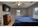 Bedroom with a bed, dresser, and view of the yard at 1277 Bethany Rd, Covington, GA 30016