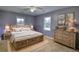 Cozy bedroom with wooden furniture, neutral tones, and natural light at 1277 Bethany Rd, Covington, GA 30016