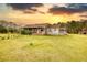 Exterior view of a home with covered front porch, landscaping, and ample lawn space at 1277 Bethany Rd, Covington, GA 30016