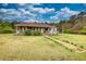 Charming brick home with a covered front porch and lush green lawn at 1277 Bethany Rd, Covington, GA 30016