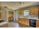Kitchen featuring light wood cabinets, white countertops and dark appliances at 1277 Bethany Rd, Covington, GA 30016