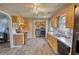 Well-lit kitchen features stainless steel appliances and access to in-kitchen laundry at 1277 Bethany Rd, Covington, GA 30016