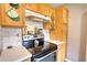 Kitchen featuring stove with black cooktop, and white countertop space at 1277 Bethany Rd, Covington, GA 30016