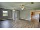 The living room showcases wood floors, open doorways and a ceiling fan providing a comfortable living space at 1277 Bethany Rd, Covington, GA 30016