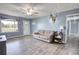 Comfortable living room with wood-look flooring, lots of light, and stylish decor at 1277 Bethany Rd, Covington, GA 30016