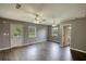 A cozy living room features multiple ceiling fans, windows for natural light, and neutral wall colors at 1277 Bethany Rd, Covington, GA 30016