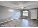 Virtually staged living room with sleek gray floors and ample natural light at 1277 Bethany Rd, Covington, GA 30016
