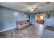 Comfortable living room with wood-look flooring, lots of light, and stylish decor at 1277 Bethany Rd, Covington, GA 30016