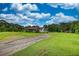 Long driveway leading to a single story house surrounded by a green yard at 1277 Bethany Rd, Covington, GA 30016
