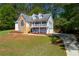 Charming two-story home with a front porch, stone accents, and well-maintained landscaping at 208 Wellington Walk, Douglasville, GA 30134