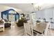 Open-concept living space with hardwood floors, a vaulted ceiling, a fireplace, and comfortable leather furniture at 208 Wellington Walk, Douglasville, GA 30134