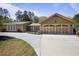 Charming single-story home featuring a welcoming entrance, beautiful landscaping, and a spacious three car garage at 3025 Greenfield Dr, Marietta, GA 30068