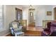 Cozy living room features hardwood floors, a decorative stone wall and half-wall, and a sunlit seating area at 3025 Greenfield Dr, Marietta, GA 30068