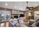 Comfortable living room with hardwood floors, a stone fireplace, and access to the backyard at 3025 Greenfield Dr, Marietta, GA 30068