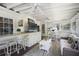 Bright sunroom featuring comfortable seating, a bar area, and ample natural light, creating a perfect space for relaxation at 3025 Greenfield Dr, Marietta, GA 30068