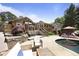 Spacious backyard features a swimming pool, patio, and outdoor seating at 3025 Greenfield Dr, Marietta, GA 30068
