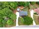 Aerial view of a single-Gathering home with a swimming pool surrounded by lush greenery at 489 Warrenton Dr, Douglasville, GA 30134