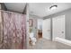 Neutral bathroom with tiled floors, a toilet, and a standing shower at 489 Warrenton Dr, Douglasville, GA 30134