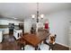 Open dining area adjacent to the kitchen with a stylish chandelier at 489 Warrenton Dr, Douglasville, GA 30134