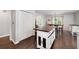 Kitchen island with seating and views to the dining area and front yard at 489 Warrenton Dr, Douglasville, GA 30134