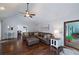 Spacious living room with hardwood floors, vaulted ceiling, and access to the back deck at 489 Warrenton Dr, Douglasville, GA 30134
