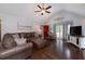 Cozy living room with hardwood floors, vaulted ceiling, and large windows at 489 Warrenton Dr, Douglasville, GA 30134